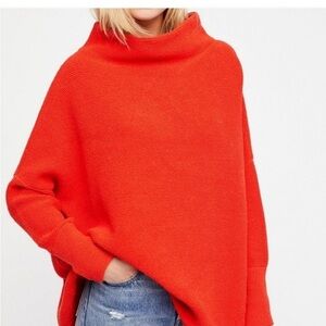Free peoples oversize small orange pull over sweater